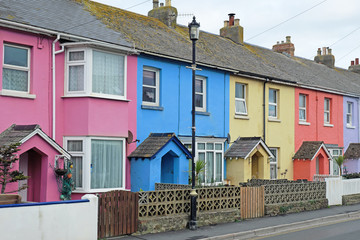 A section of colorful terraced housing in a west country seaside town, England