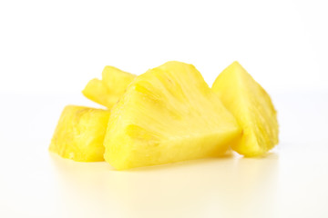 Closeup Pineapple chunks on white background