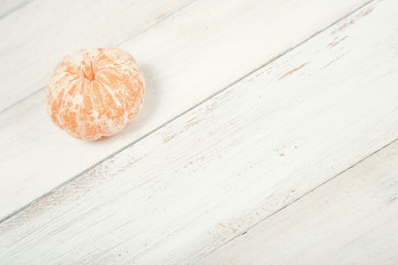 Slices of tangerine (mandarin) on wooden background