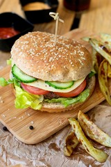 Beef hamburger with whole wheat bun and french fries