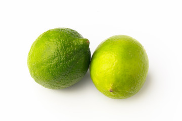 Closeup of two spotted bright green limes