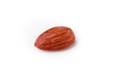 Single isolated raw almond on white background