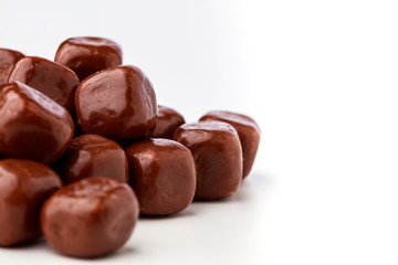 Closeup stack of square chocolates off centre
