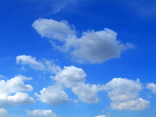 Naklejka na ściany i meble Clouds in the Blue Sky Background