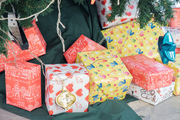 Fototapeta na wymiar Christmas gift boxes / View of christmas gift boxes under christmas tree.
