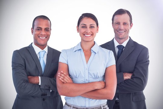 Small Group Of Smiling Business People Standing Together