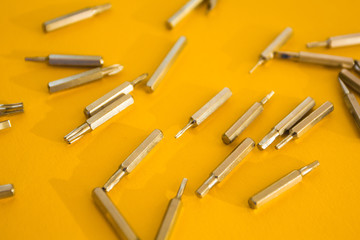 screwdriver set on a yellow background, concept.