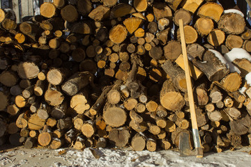 Axe chopping woods, pieces of woods ready for winter home cabin fire