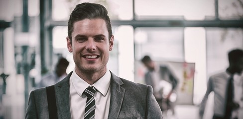 Smiling businessman in office