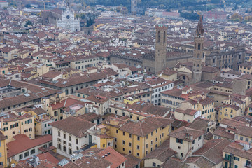 Fototapeta na wymiar Red roofs of old houses Florence seen from the observation platform Duomo, Cathedral Santa Maria del Fiore.