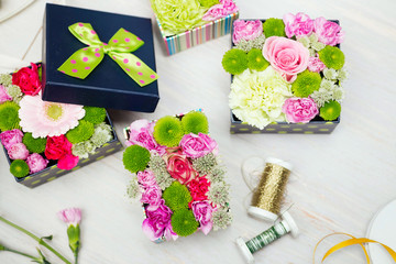 Top down view of modern, colorful flower boxes - unusual alternative to chocolates for Mother's or Valentine's day.