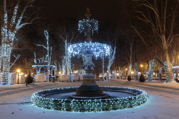 Naklejka premium Zrinjevac park Fountain decorated by Christmas lights as part of Advent in Zagreb. Fountain is known as The Mushroom.