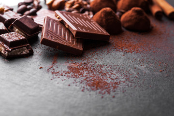Variety of sweet homemade chocolate pralines on wooden background