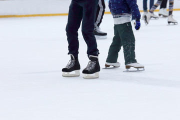 Fototapeta premium people skating on the ice rink