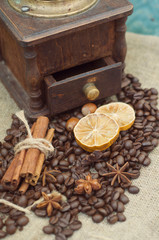 Manual coffee grinder. Cinnamon, star anise and coffee beans