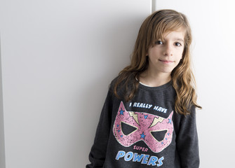 Portrait of little girl on a white background with