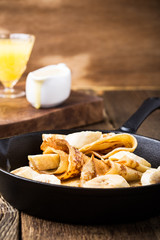 Crepes with bananas and  cream caramel sauce