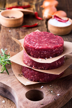 Raw ground beef, round patties for making burgers