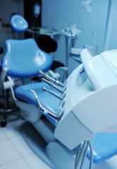 Modern dental equipment close up on a background of blue dental chair