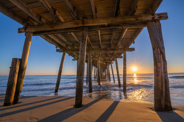 Sunrise from underneath Nags Head Pier 