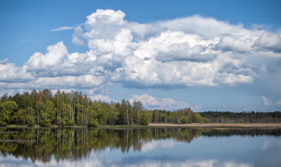 Fototapeta na wymiar Landscape of sky with clouds pond Beautiful white billowing against a blue .