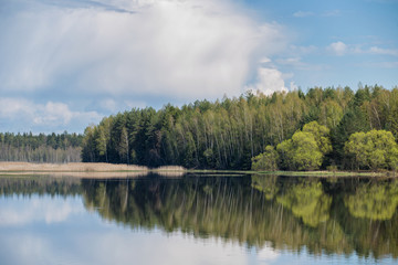 Landscape of sky with clouds pond Beautiful white billowing  against a blue .