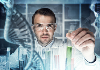 Young scientist mixing reagents in glass flask in clinical laboratory