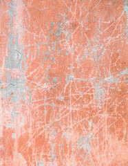 Red, plastered walls with cracks and irregularities