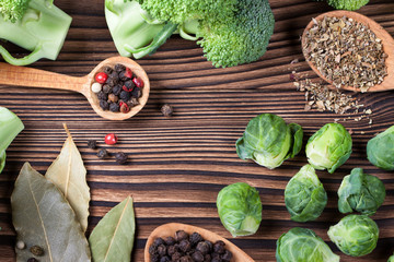 beautiful still life with herbs and spices on a wooden table. Horizontal top view