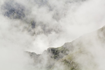 Landscape from Bucegi Mountains, part of Southern Carpathians in Romania in a very foggy day
