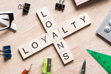 Conceptual business keywords on table with elements of game making crossword