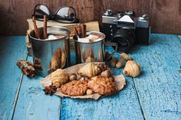 Metal mugs with cacao and marshmallows