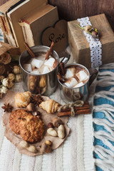 Metal mugs with cacao and marshmallows