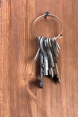 keys hanging on a wooden wall