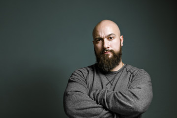 brutal bald man with a beard - obrazy, fototapety, plakaty