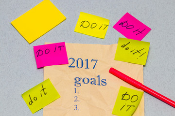 a sheet of paper with a list of objectives for 2017, with sticke