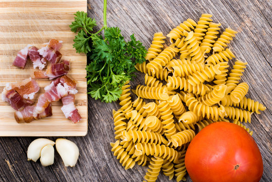 Pasta, tomato, smoked ham in natural light