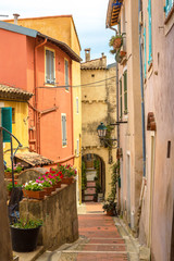Fototapeta na wymiar Old narrow street in Menton, France