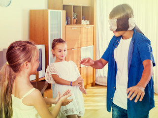 children playing at Blind man bluff indoors