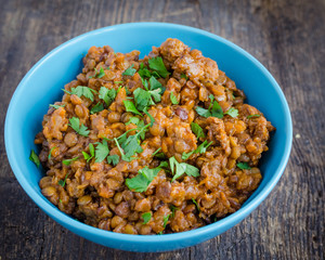 Lentil stew in a bowl with parsley