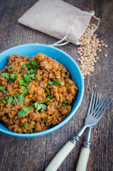 Lentil stew in a bowl with parsley