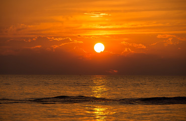 boat wake ripple on Lake Michigan with sunset sky
