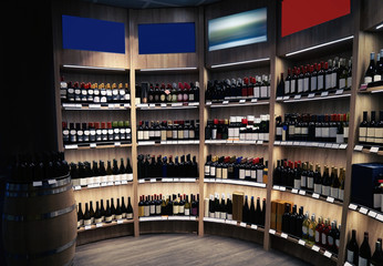 Wine bottles on wooden shelves at liquor store