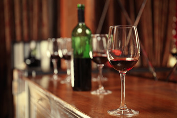 Glass of red wine on bar counter