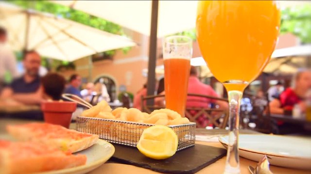 Dinner in cafe. Lunch on the terrace outside. A lot of people are sitting in a cafe and eating. Blurred background. 1080p full HD video footage