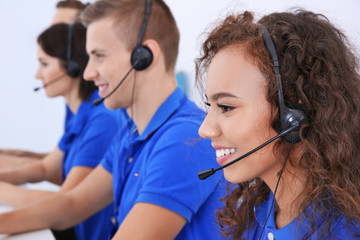 Friendly team of technical support dispatchers working in office