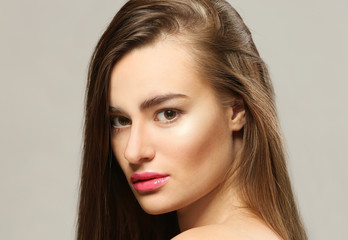 Fototapeta premium Portrait of beautiful young woman on grey background, close up