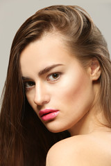 Fototapeta premium Portrait of beautiful young woman on grey background, close up