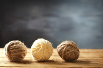 Balls of  knitting yarn on wooden table