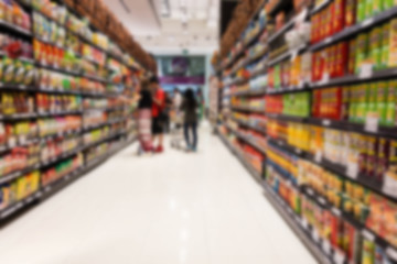 Supermarket blur background with miscellaneous product shelf - obrazy, fototapety, plakaty